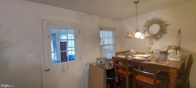 dining room with a notable chandelier