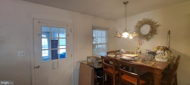 dining area featuring a chandelier