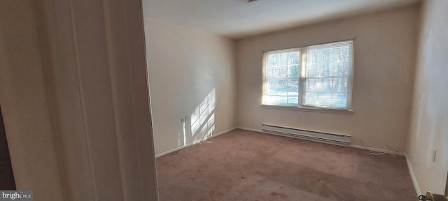 carpeted empty room with baseboards and a baseboard radiator