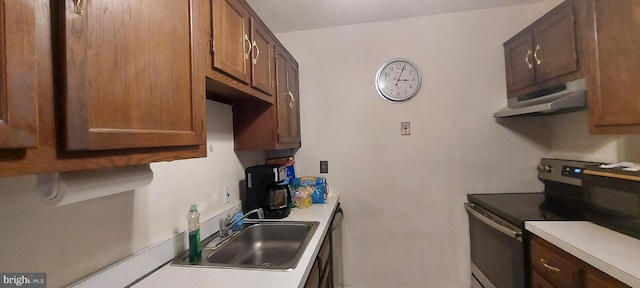 kitchen with stainless steel electric stove and sink