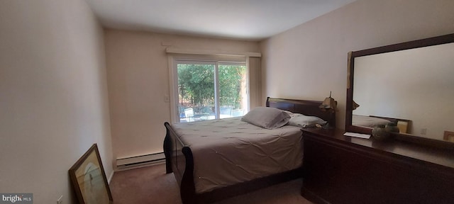 bedroom with a baseboard radiator and carpet floors