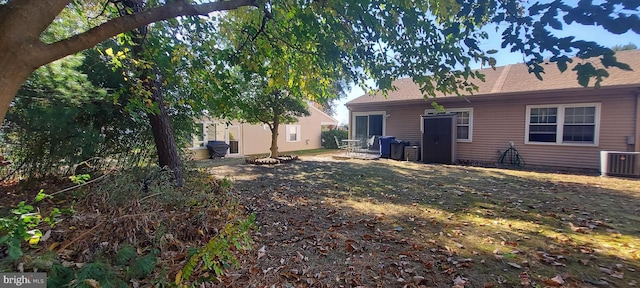 view of yard with central AC