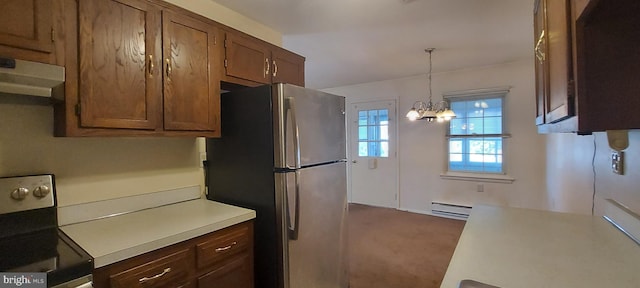 kitchen featuring under cabinet range hood, stainless steel appliances, dark carpet, light countertops, and baseboard heating