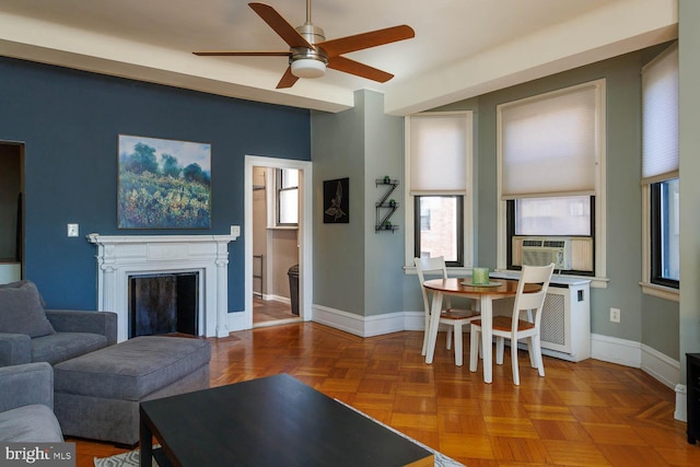 living room featuring parquet floors and ceiling fan