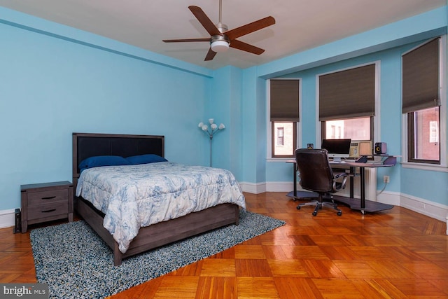 bedroom with parquet flooring and ceiling fan