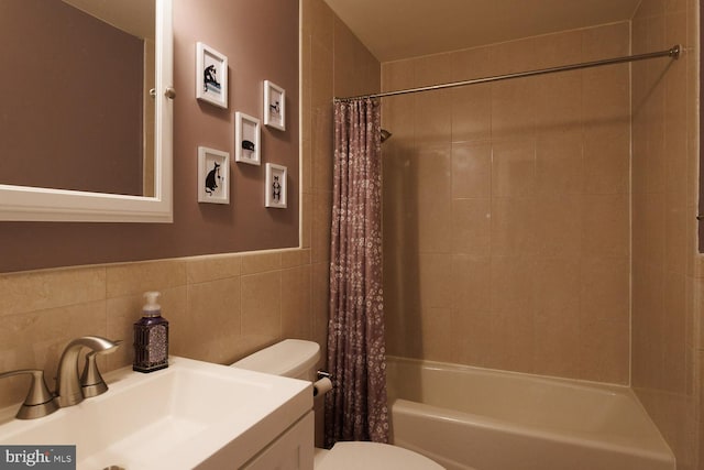 full bathroom featuring vanity, tile walls, toilet, and shower / tub combo with curtain