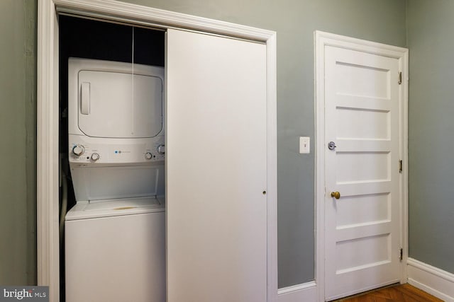 clothes washing area with stacked washer / drying machine