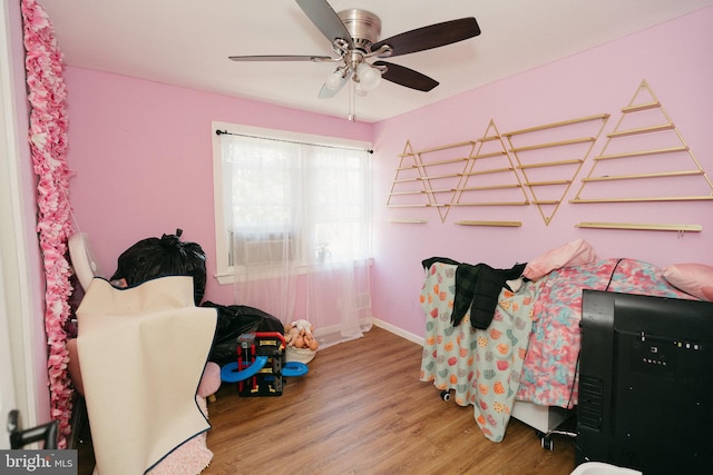 bedroom with wood-type flooring and ceiling fan