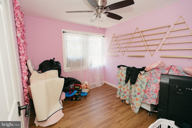 bedroom with hardwood / wood-style flooring and ceiling fan