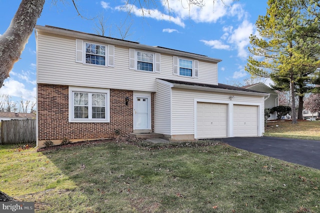 view of front property featuring a garage and a front lawn