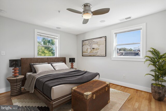 bedroom featuring light hardwood / wood-style floors and ceiling fan