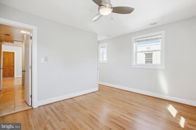 unfurnished room featuring light hardwood / wood-style flooring and ceiling fan