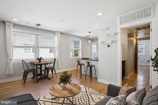 living room with light hardwood / wood-style floors