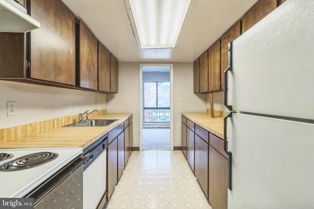 kitchen featuring sink and white appliances