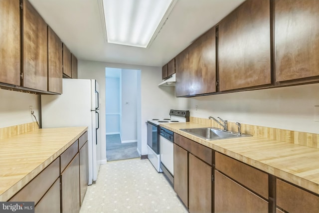 kitchen featuring white appliances and sink