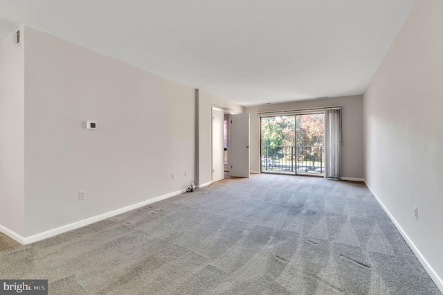 spare room with light colored carpet