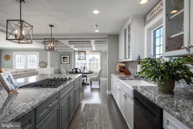 kitchen with white cabinets, pendant lighting, and a wealth of natural light