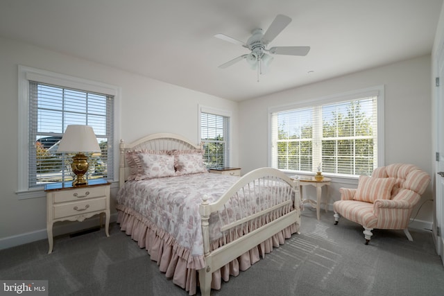 bedroom with dark colored carpet and ceiling fan