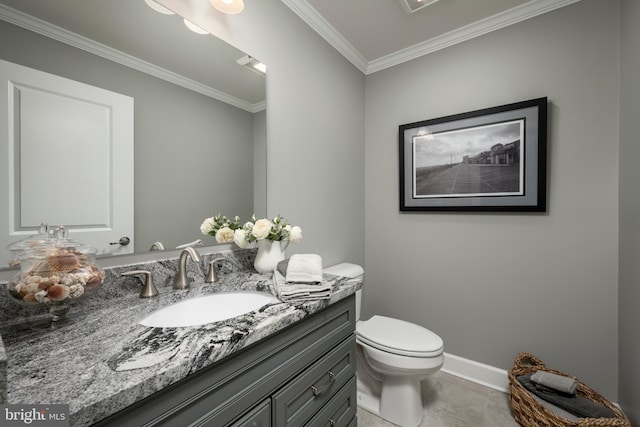 bathroom featuring toilet, ornamental molding, vanity, and tile patterned floors