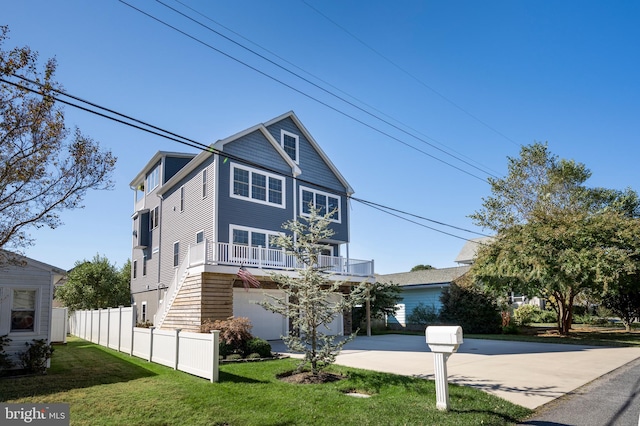 view of front facade with a front yard and a garage