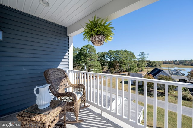 balcony featuring a water view