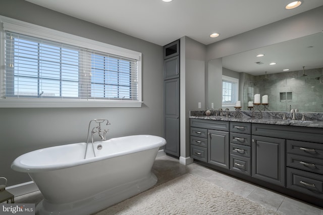 bathroom with vanity, independent shower and bath, and tile patterned flooring