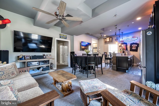 carpeted living room featuring ceiling fan