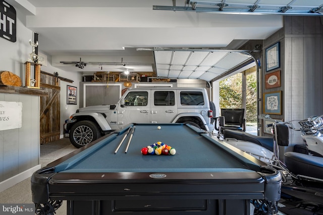 game room featuring a barn door and billiards