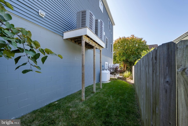 view of side of home featuring a lawn