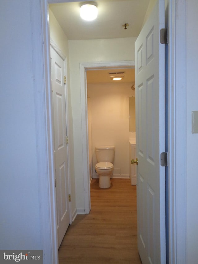 corridor featuring hardwood / wood-style flooring