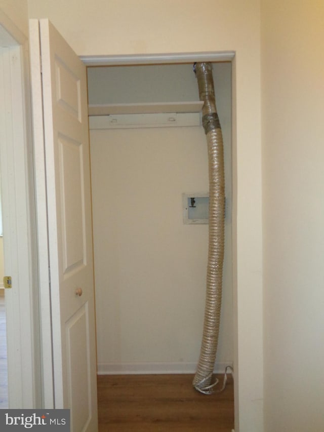 laundry room with washer hookup and dark hardwood / wood-style flooring