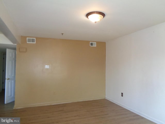 spare room featuring light hardwood / wood-style floors