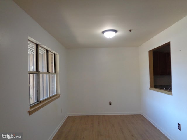 spare room featuring light hardwood / wood-style floors