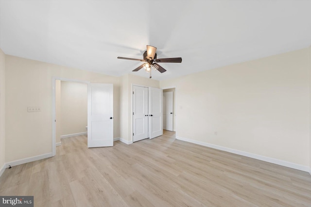 unfurnished bedroom featuring light hardwood / wood-style flooring and ceiling fan