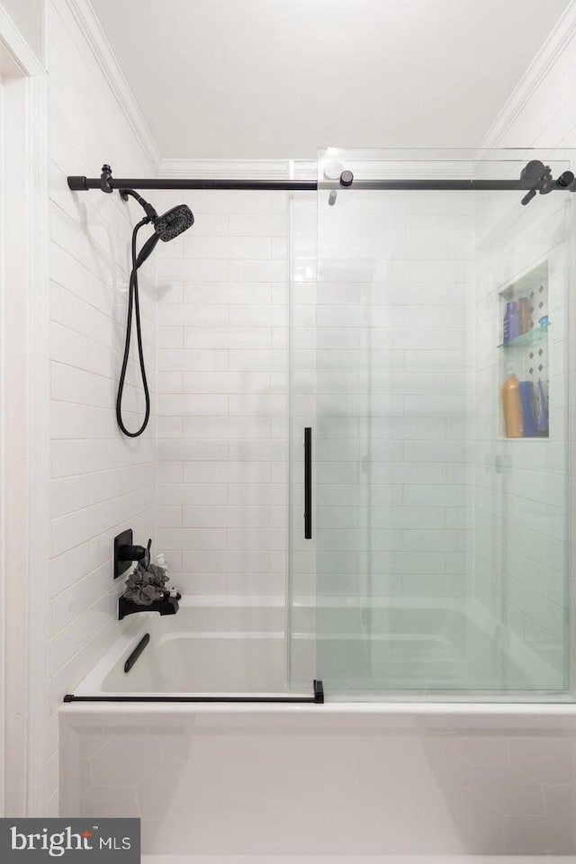 bathroom featuring shower / bath combination with glass door and crown molding