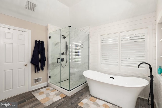 bathroom with shower with separate bathtub