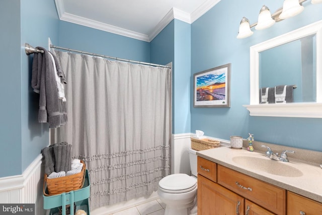 bathroom with vanity, tile patterned flooring, toilet, ornamental molding, and walk in shower