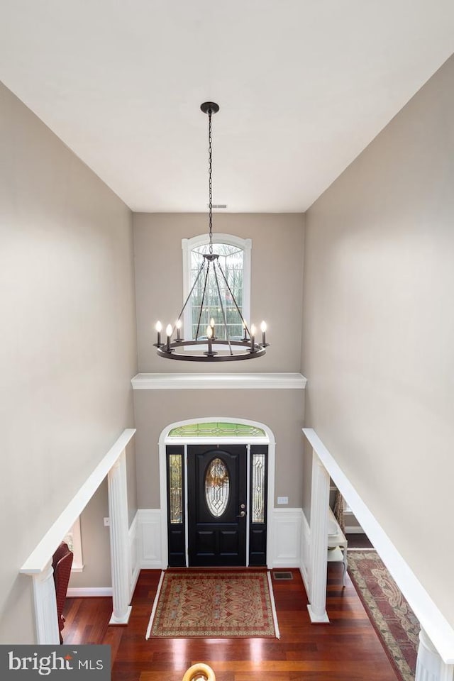 entryway with dark hardwood / wood-style flooring