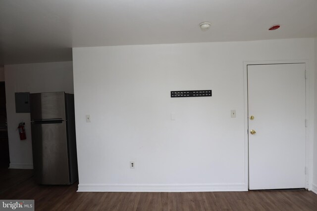 spare room featuring dark hardwood / wood-style floors