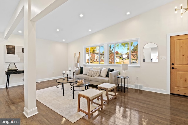 living room with dark hardwood / wood-style floors and high vaulted ceiling