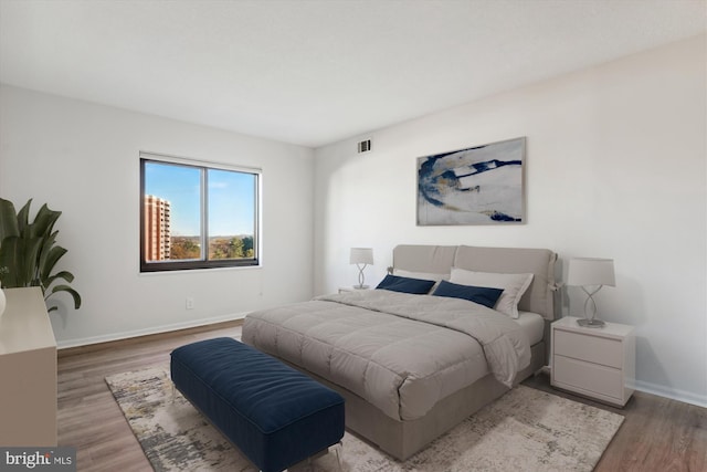 bedroom with light wood-type flooring