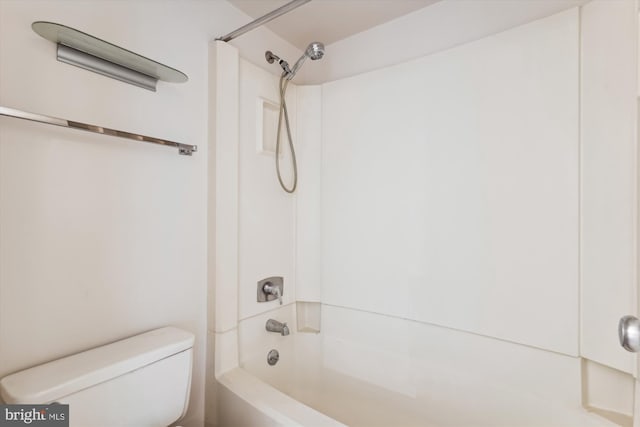 bathroom featuring toilet and tub / shower combination