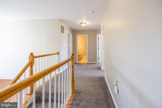 hallway with carpet