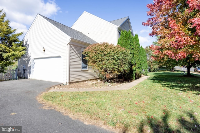 view of home's exterior featuring a yard