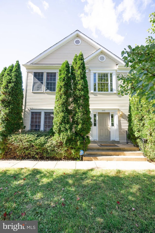 view of front of home with a front yard