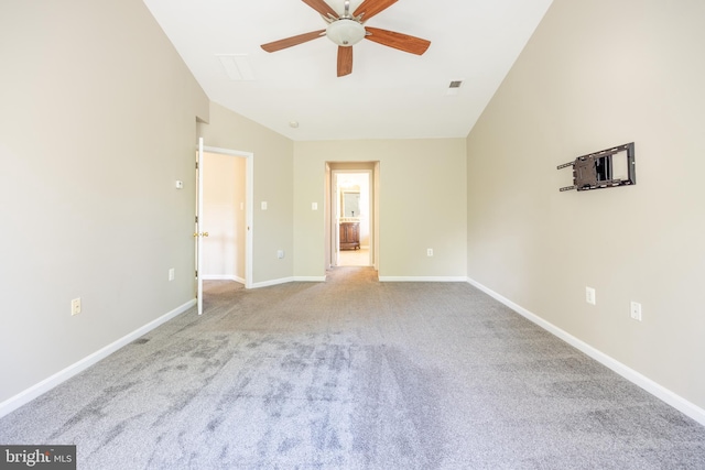 carpeted spare room with ceiling fan