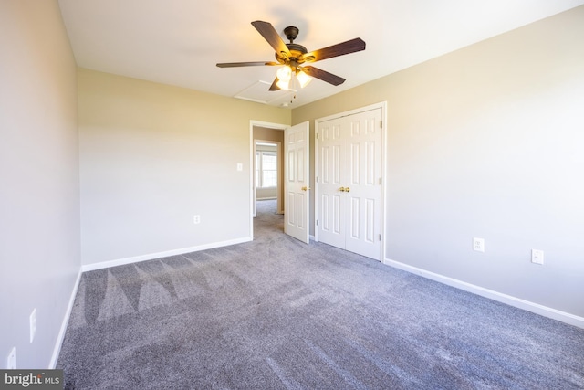 unfurnished bedroom with ceiling fan, carpet floors, and a closet