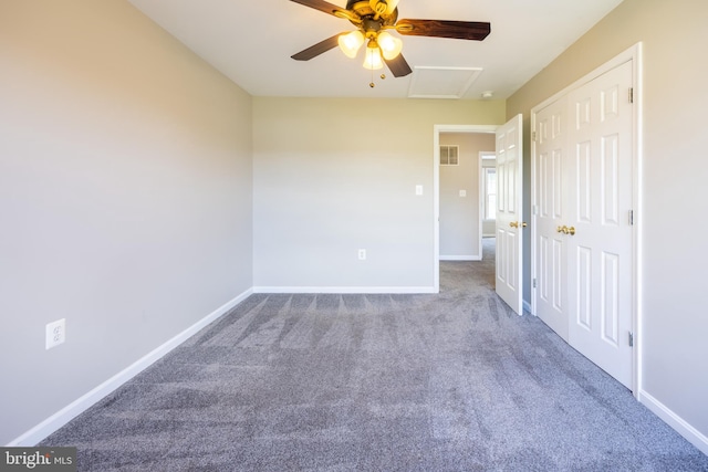 unfurnished bedroom featuring carpet and ceiling fan