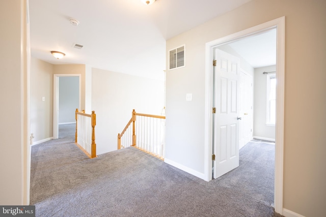 hallway with dark carpet