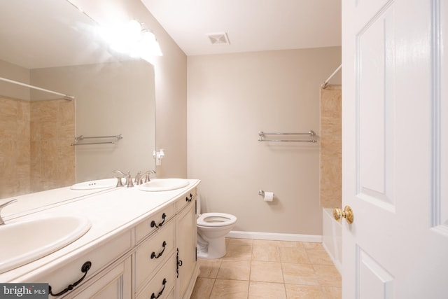 full bathroom with tiled shower / bath, vanity, tile patterned flooring, and toilet